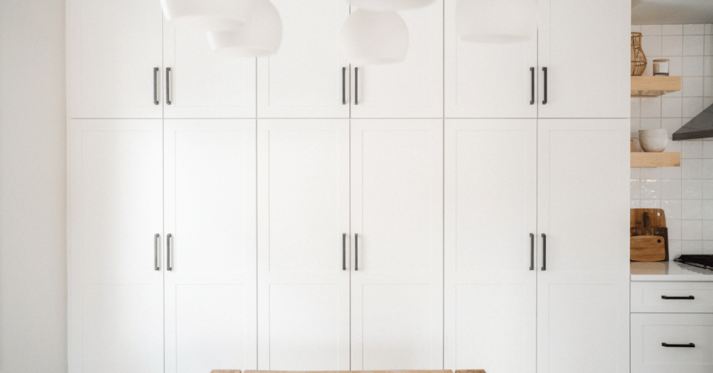 A wall of tall cabinet pantries closed.