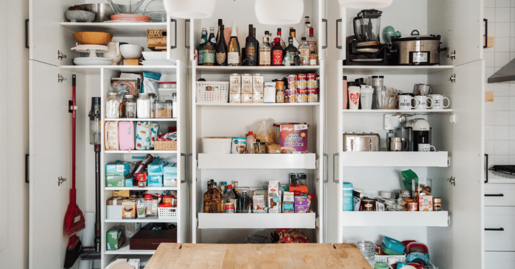 A wall of tall cabinet pantries closed.