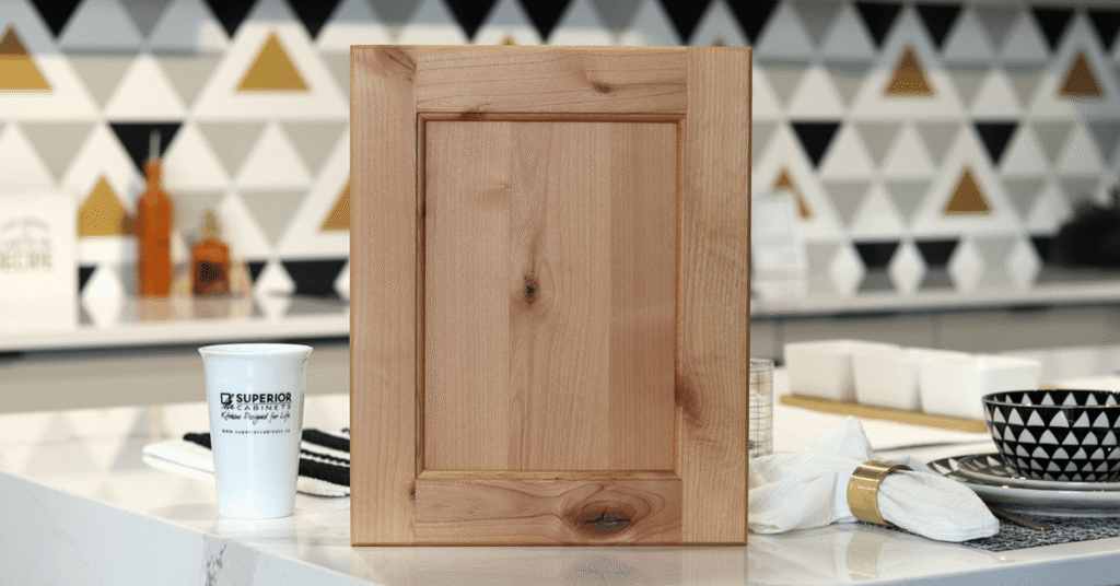 the burlington door in rustic knotty alder, natural stain by superior cabinets