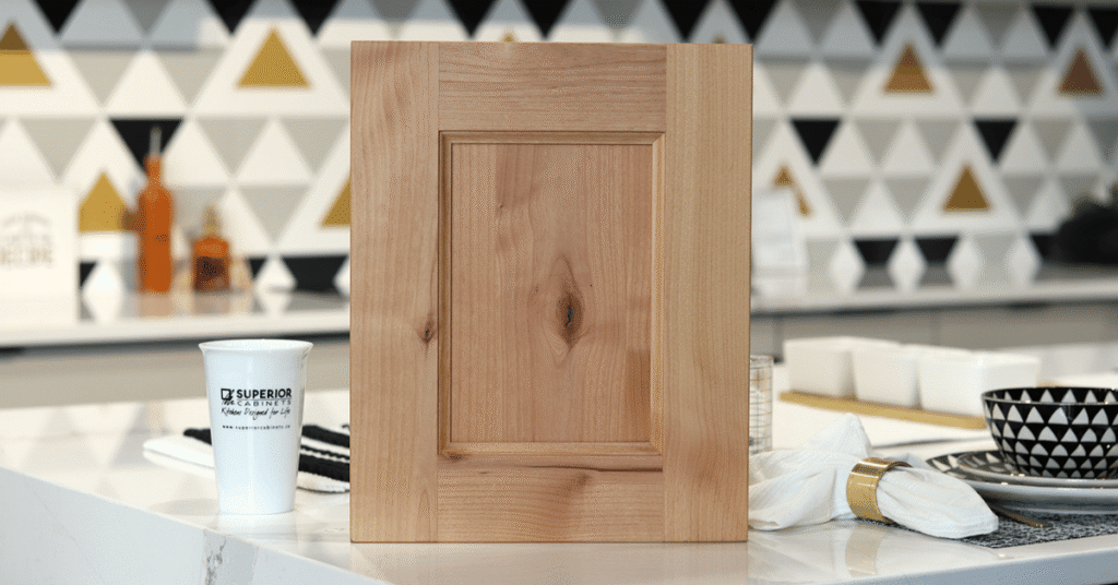 the michigan door in rustic knotty alder, natural stain by superior cabinets
