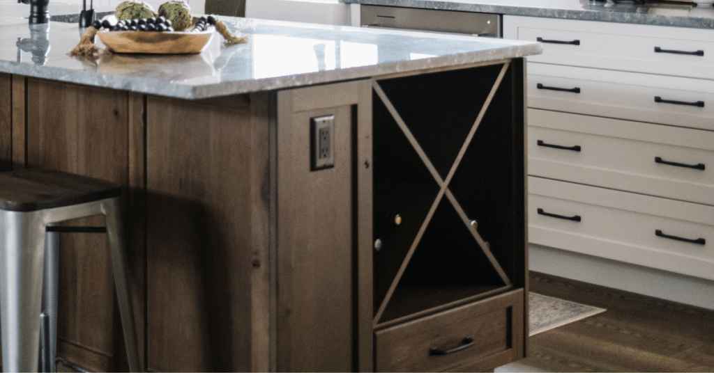 the X WINE RACK inside a kitchen island, on the side in a dark wood stain on rustic wood. Project COCOA.